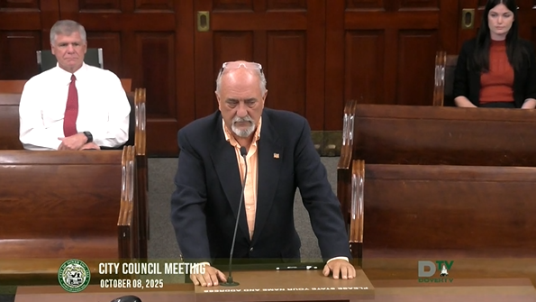 Video screenshot of man at podium at Oct 8 2025 meeting