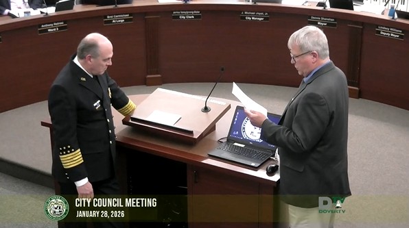 Fire Chief Plummer on left receives recognition from Mayor Shanahan